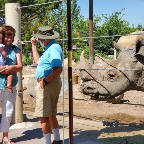 George with volunteer and guests