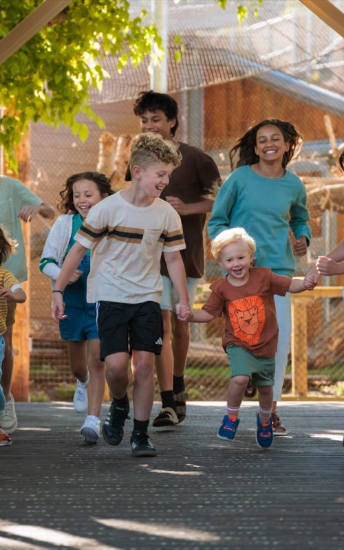 Kids running across Stillman Bridge